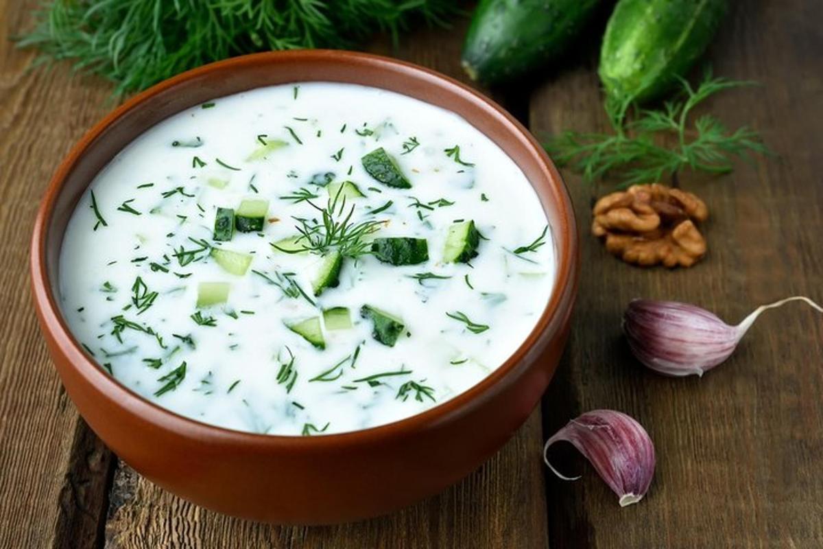 a bowl of soup with broccoli and other vegetables