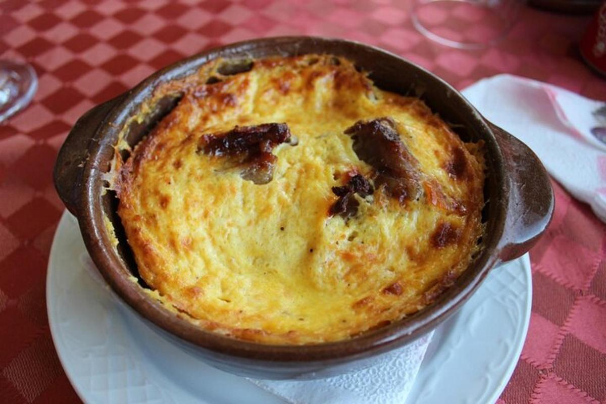 a pot of food on a plate on a table