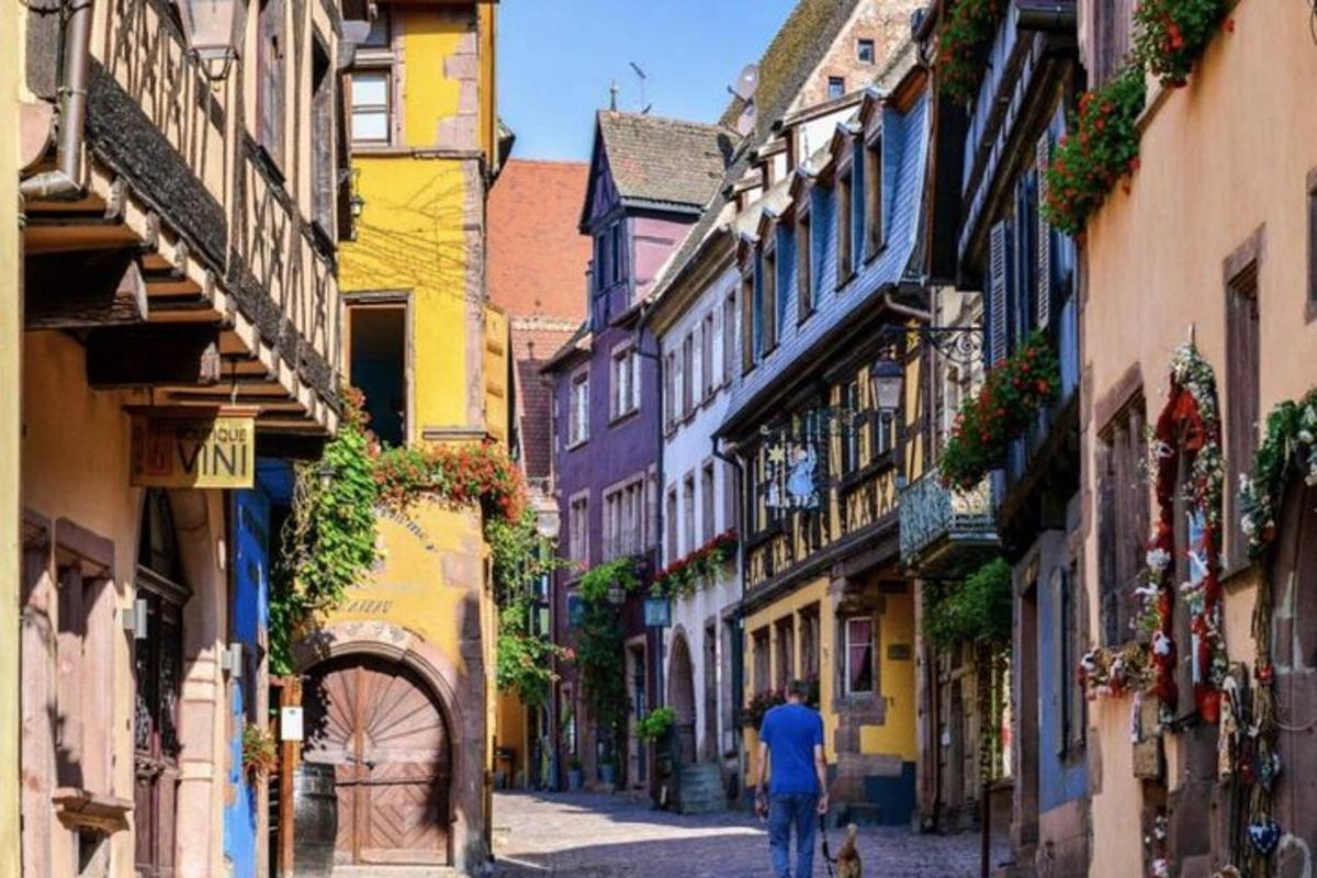 a man walking down a street in an alley