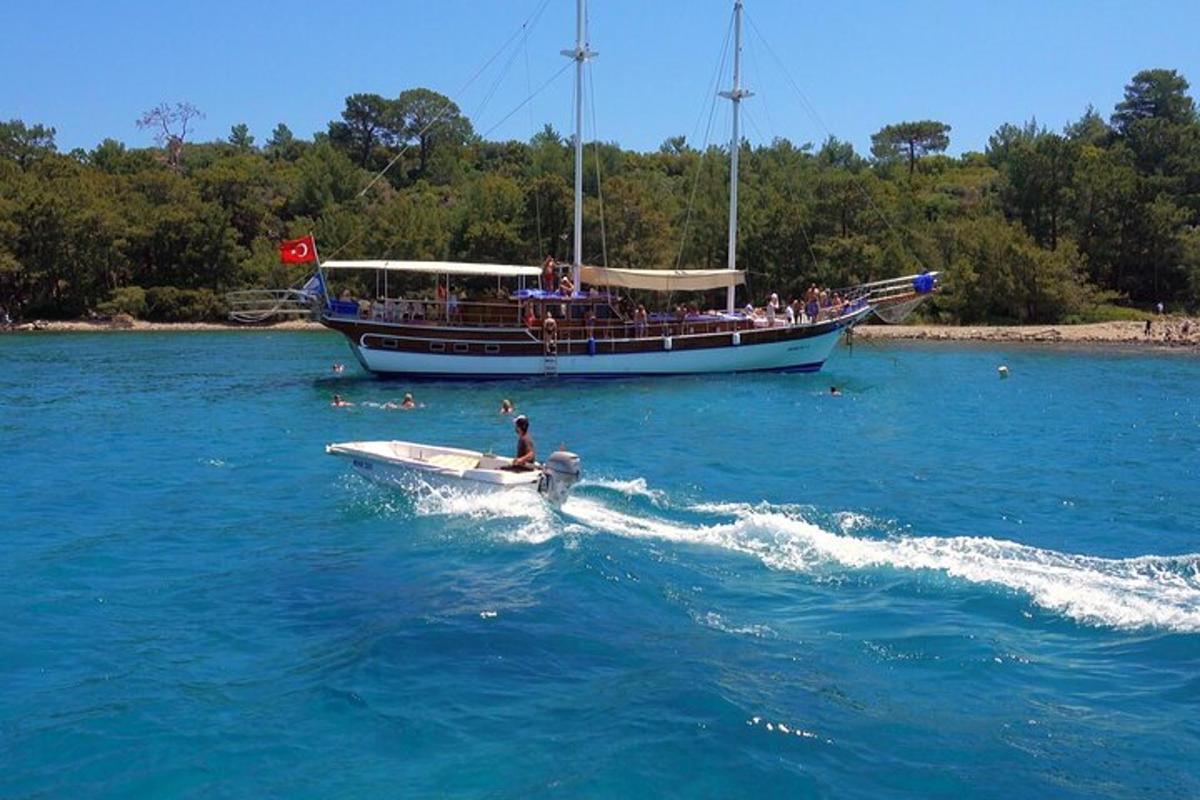 a boat with a group of people on it in the water