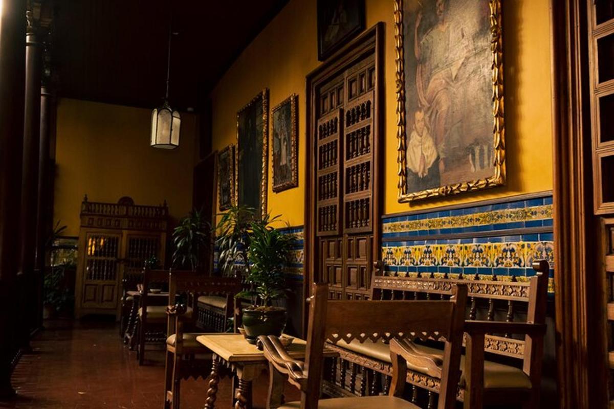 a restaurant with tables and chairs and a painting on the wall