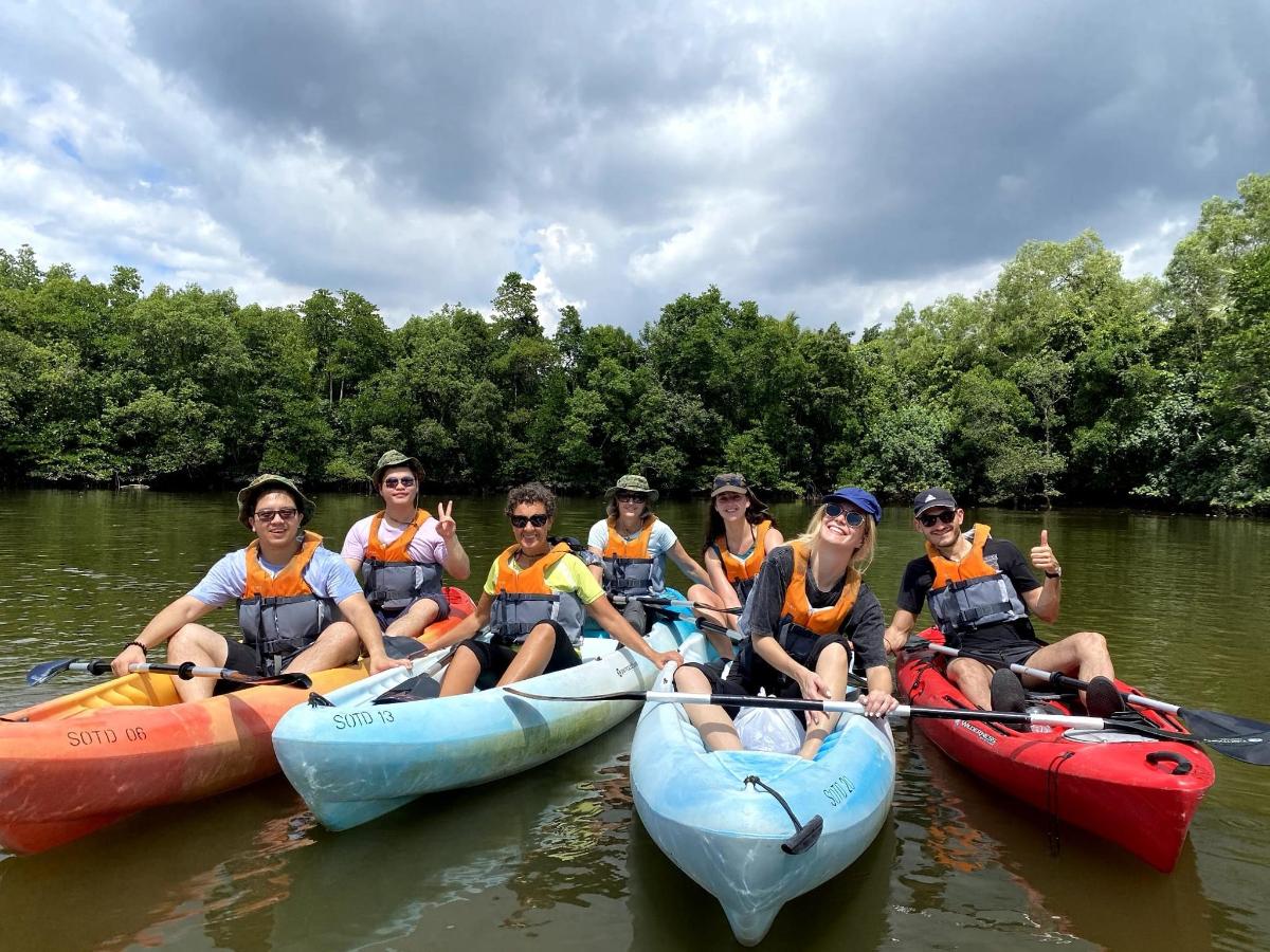 a group of people on kayaks in the water