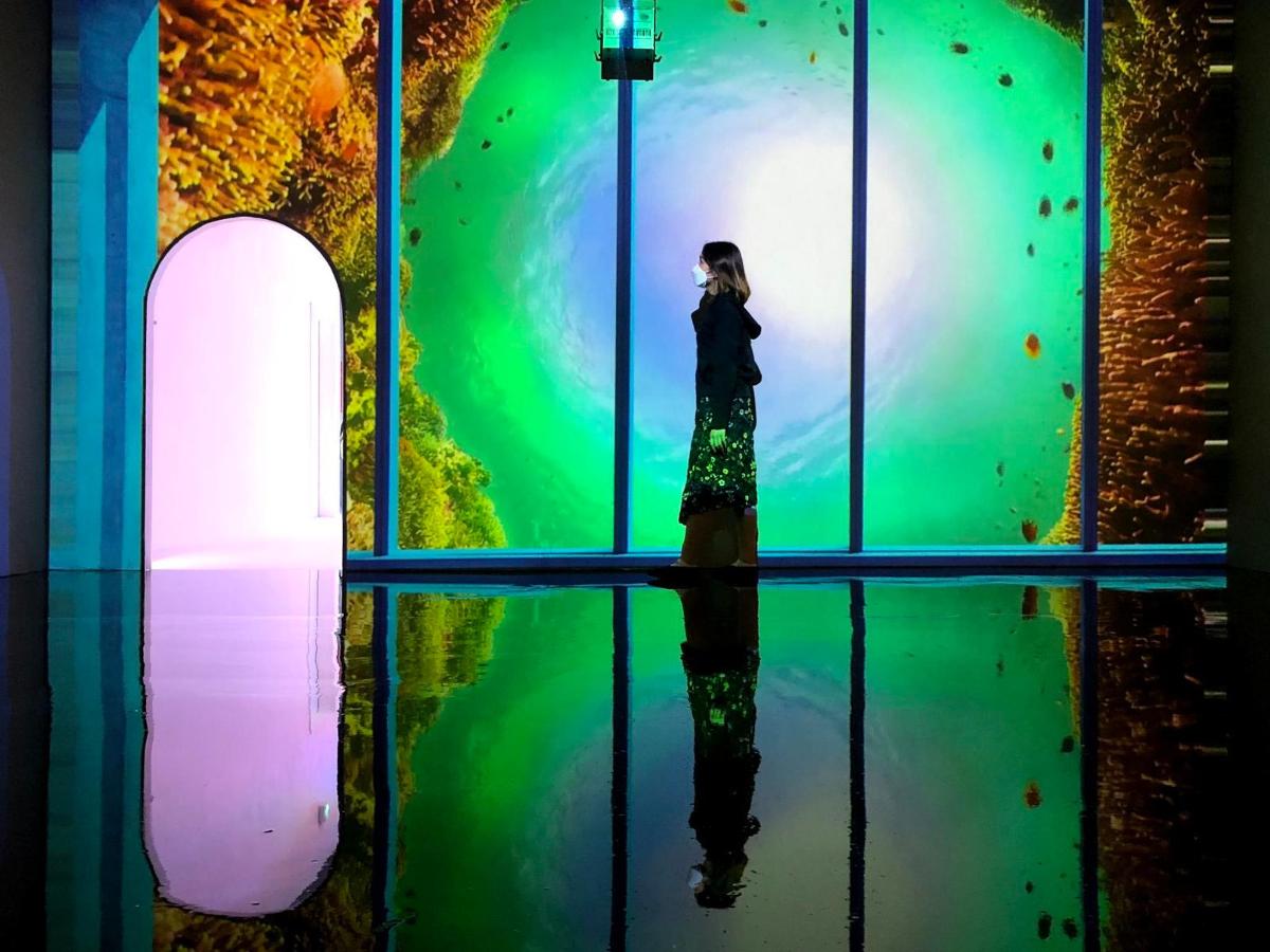 a woman standing in front of a display window