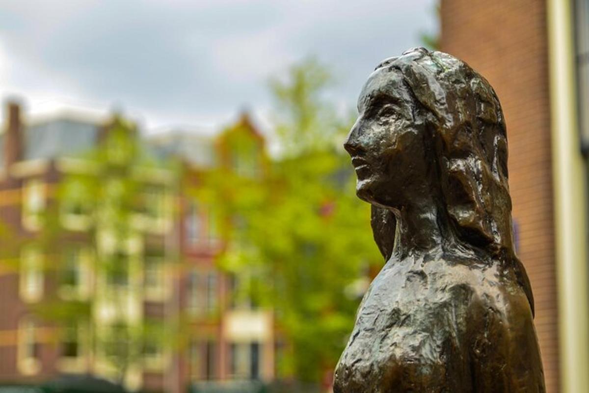 a statue of a woman in front of a building