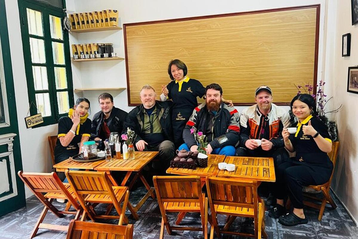 a group of people sitting at tables in a restaurant