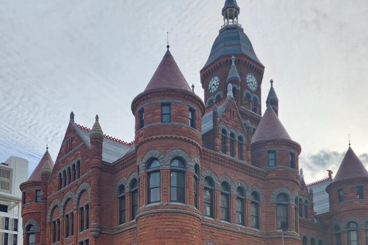a large red brick building with a clock tower