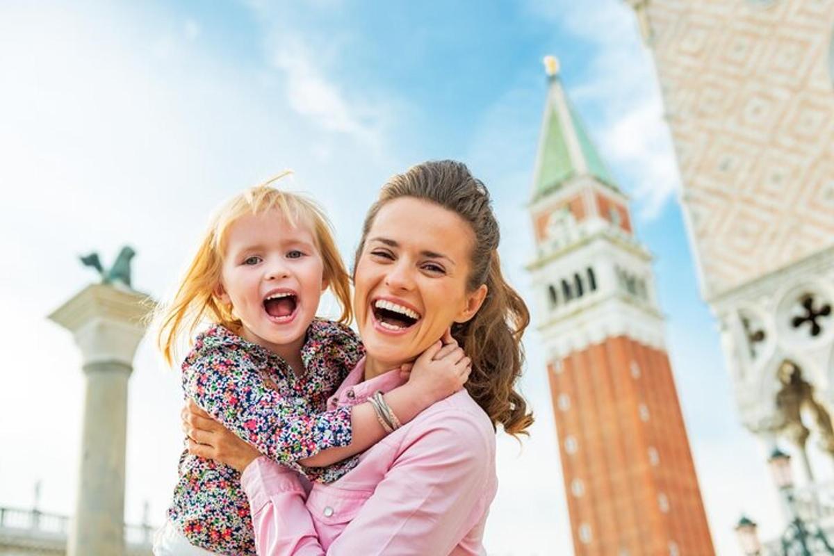 a woman hugging a little girl in front of a clock tower