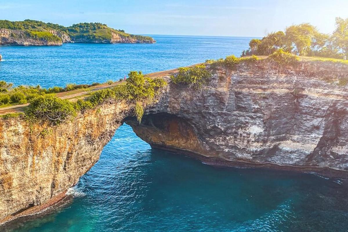 an archway in a rock formation in the ocean