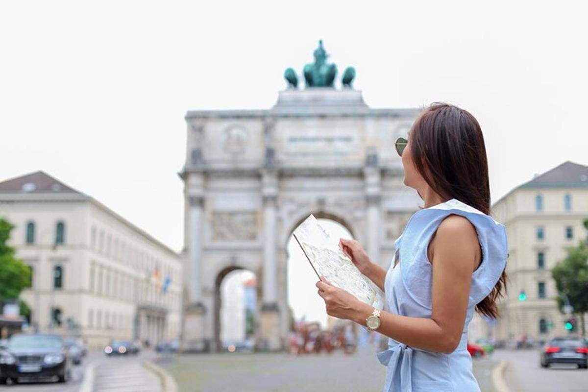 a woman holding a map in front of a building