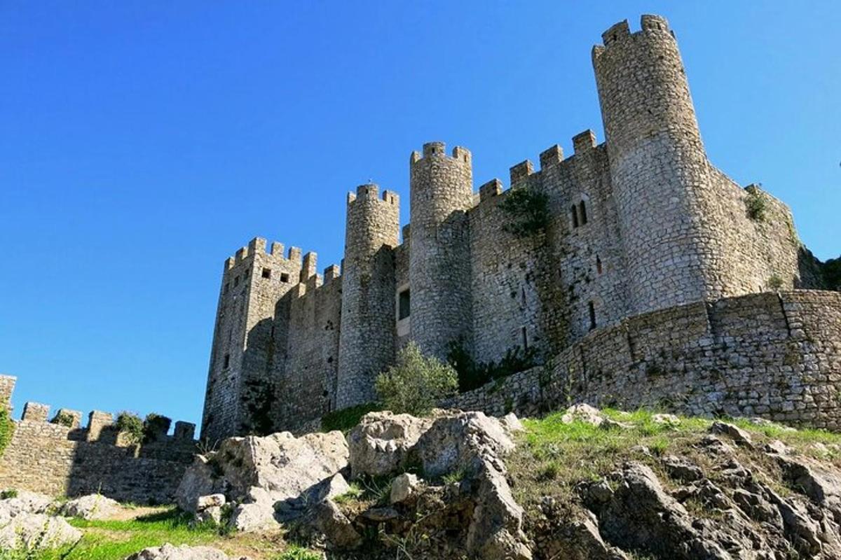 a castle sitting on top of a hill