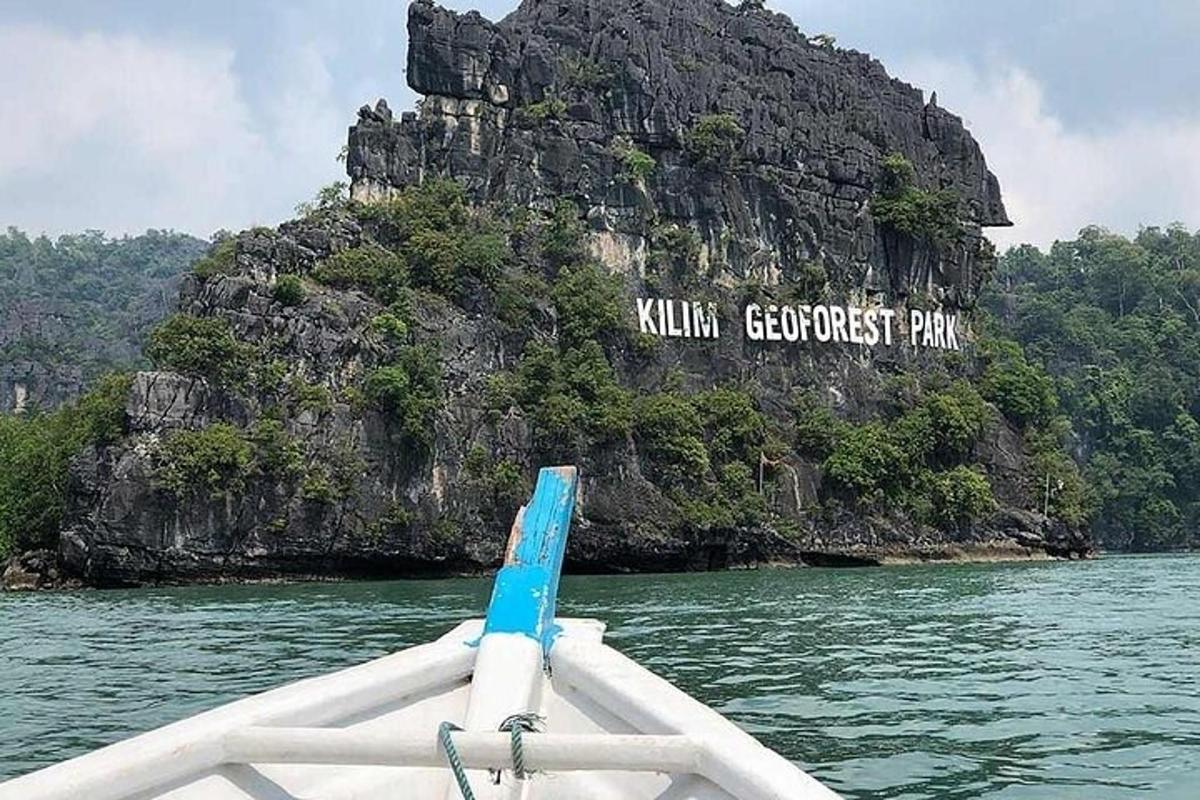 a boat in the water in front of an island