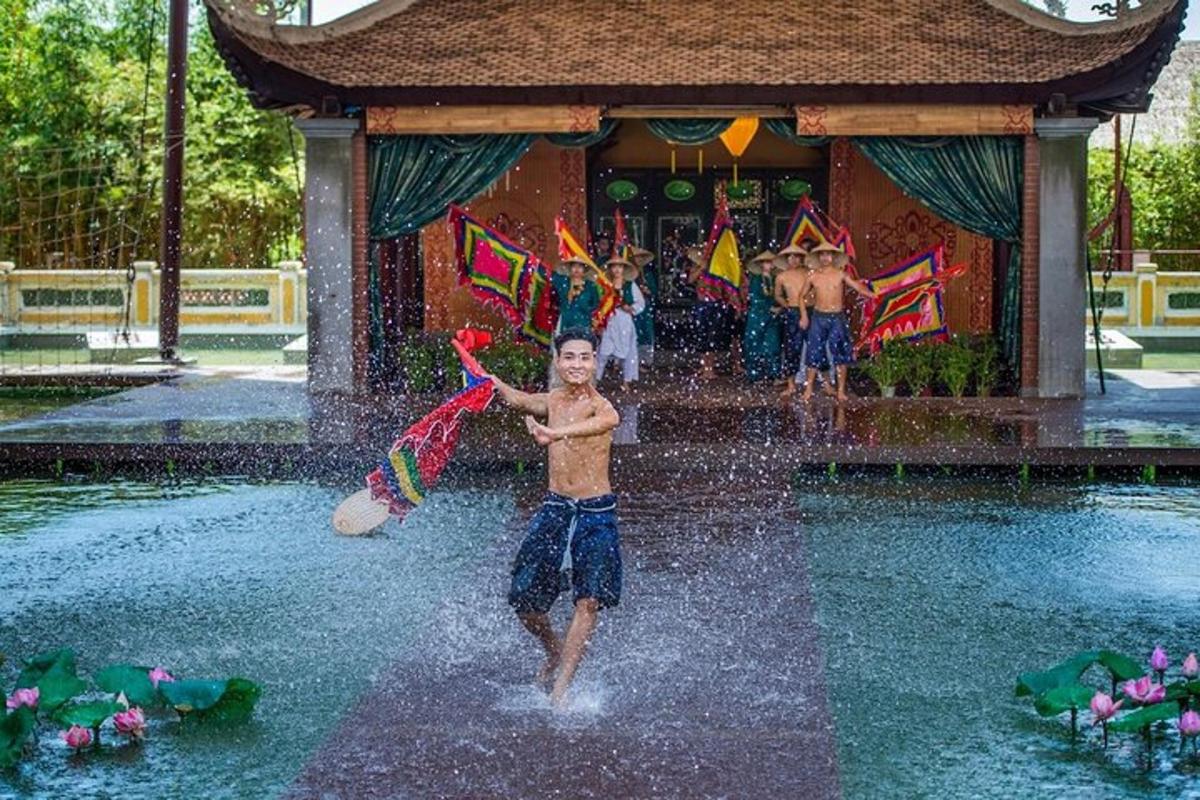 a young boy running through a water fountain