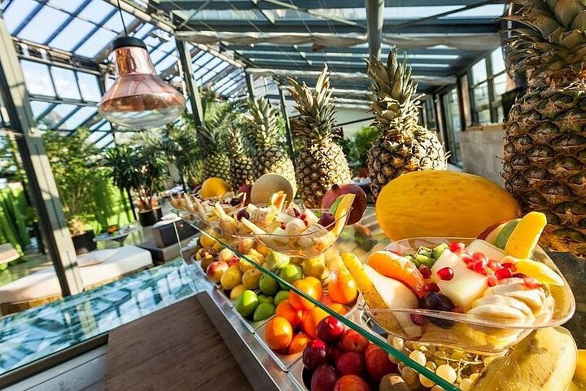 a display of fruits and vegetables in a greenhouse