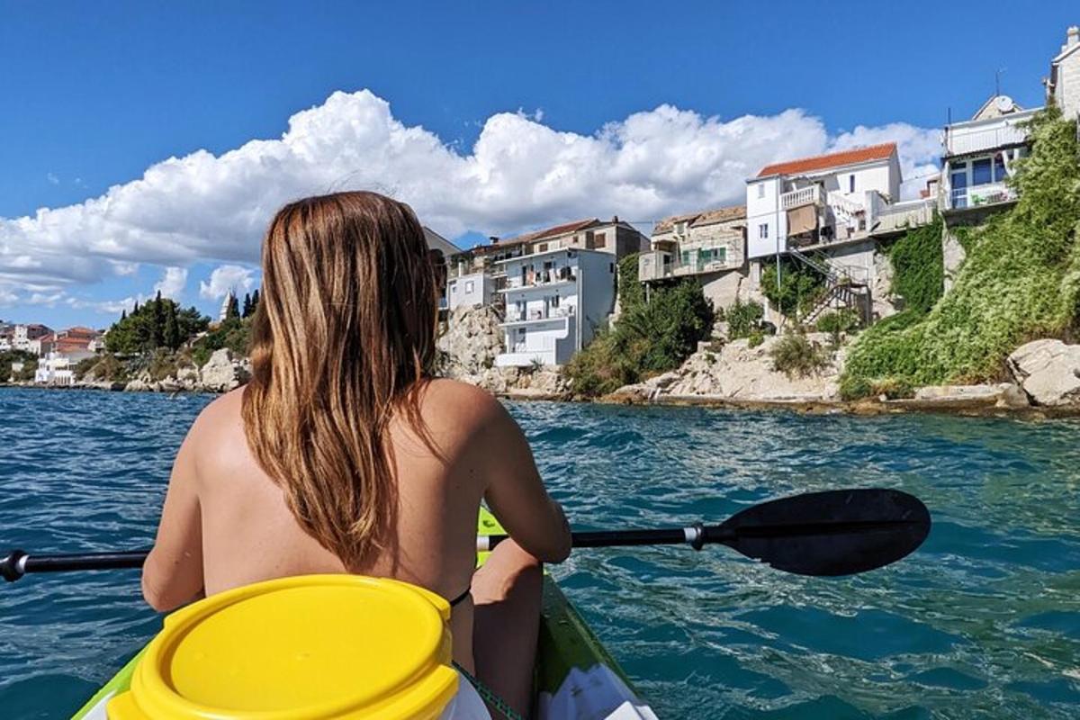 a woman in a kayak on a body of water