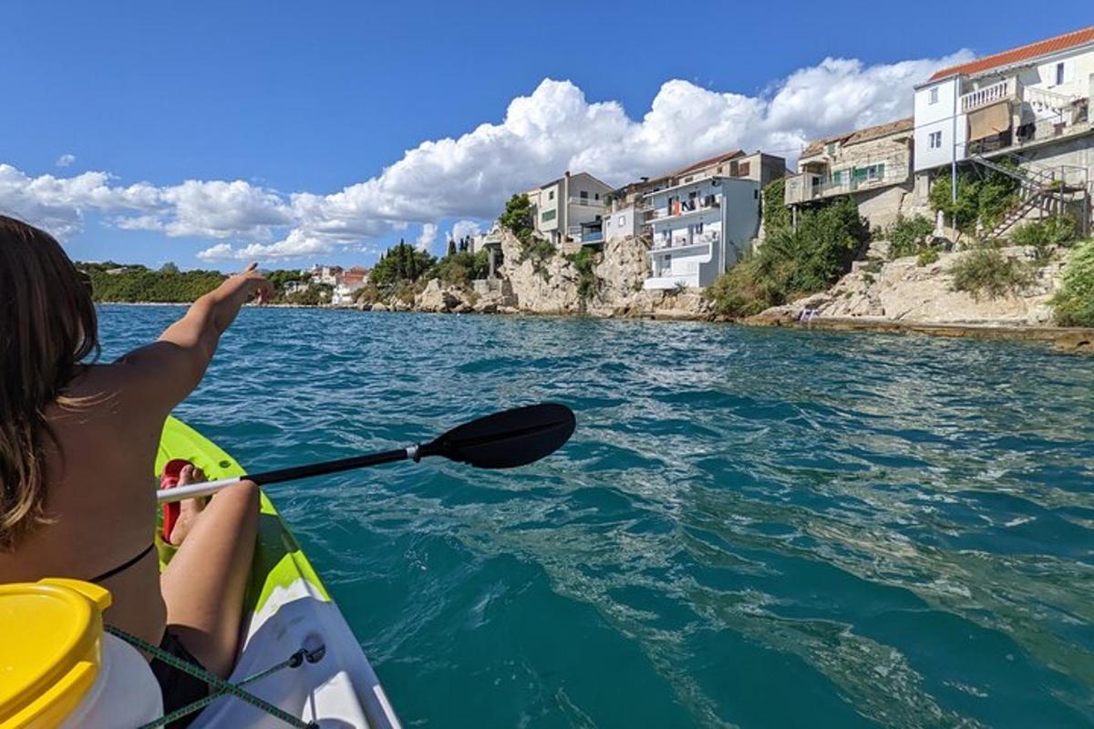 a woman is paddling a kayak on a river