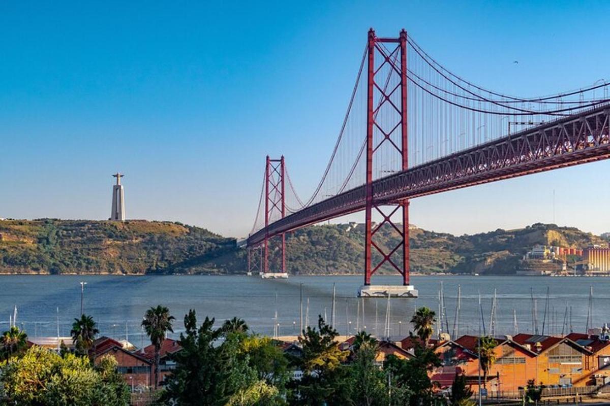 a bridge over a body of water with houses under it