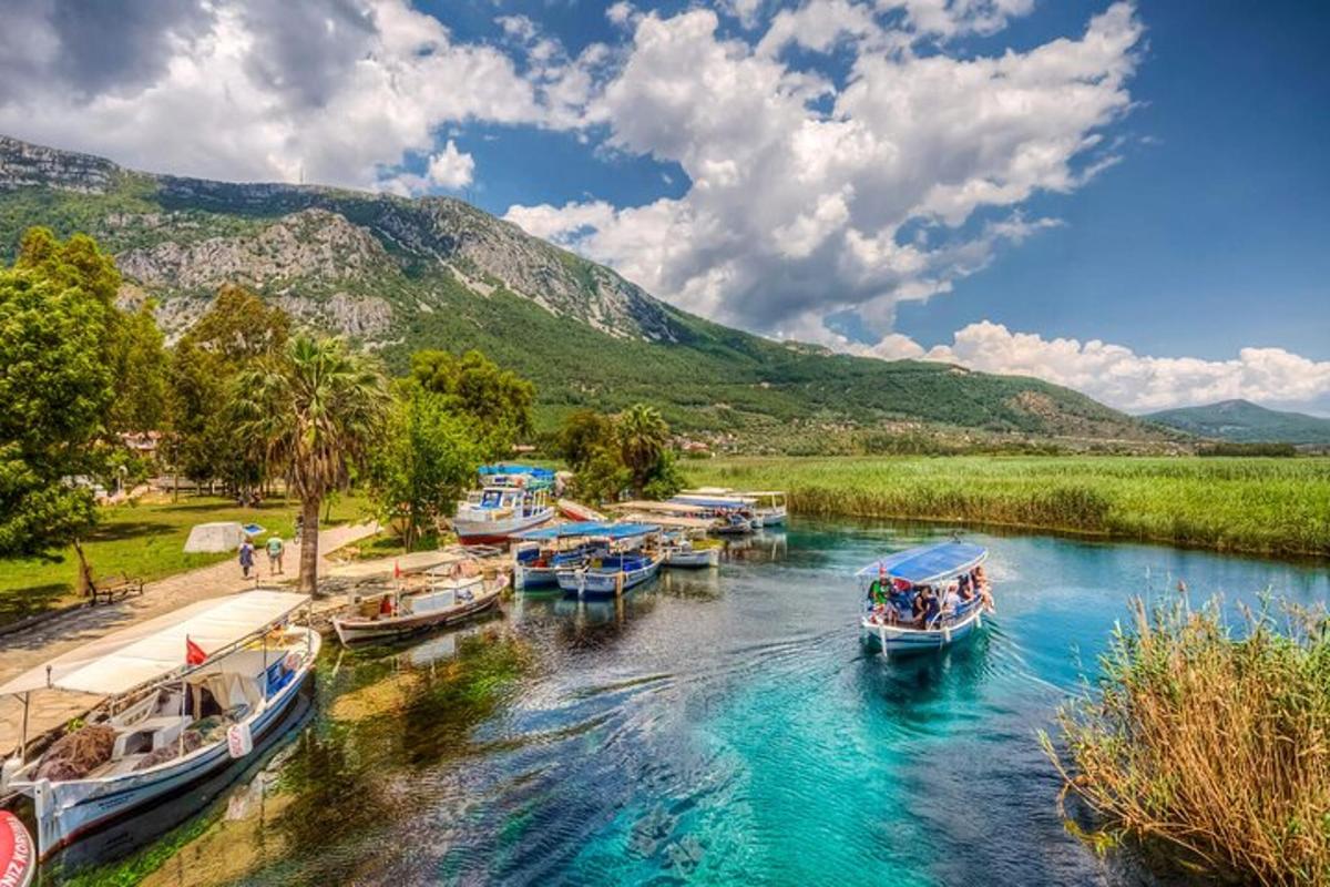 a group of boats are docked on a river