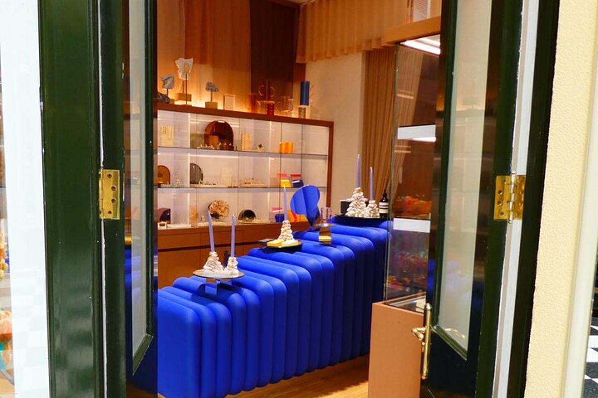 a room with a row of blue tables with trophies