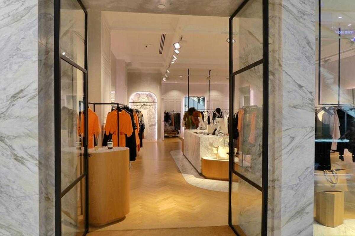 a clothing store with glass doors in a building
