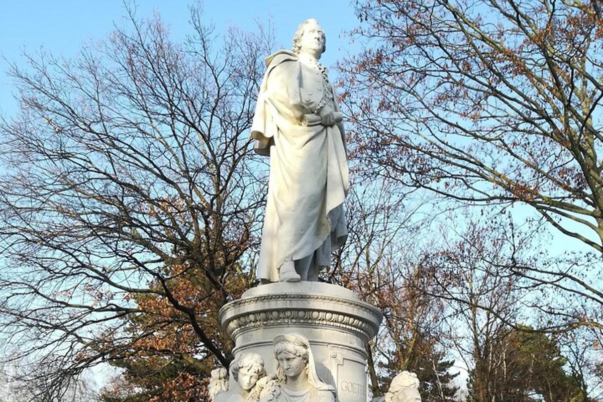 a statue of a man standing on a pedestal