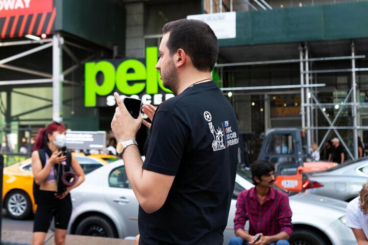 a man taking a picture with his cell phone