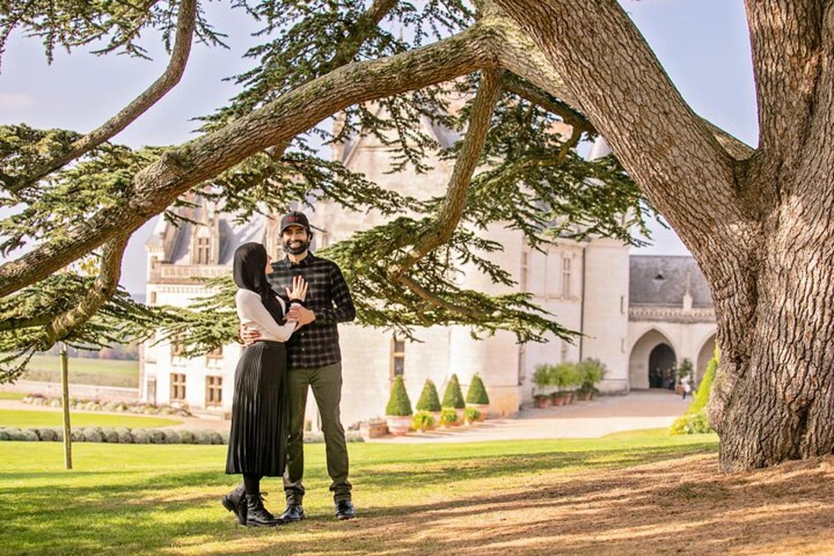 a man and a woman standing under a tree