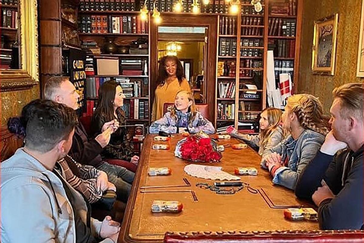 a group of people sitting around a table
