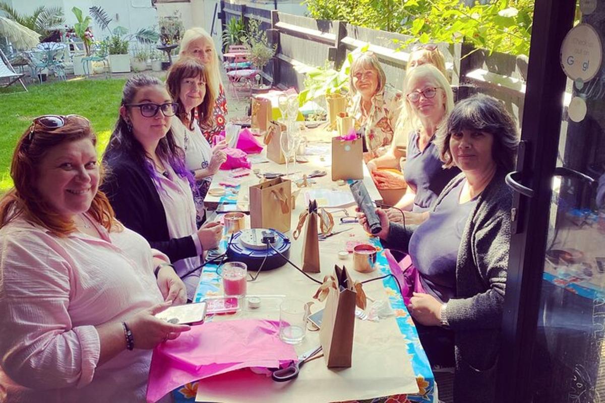 a group of women sitting at a long table