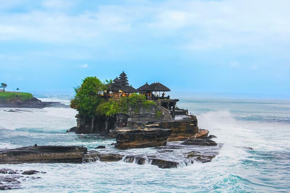 an island in the ocean with a house on it