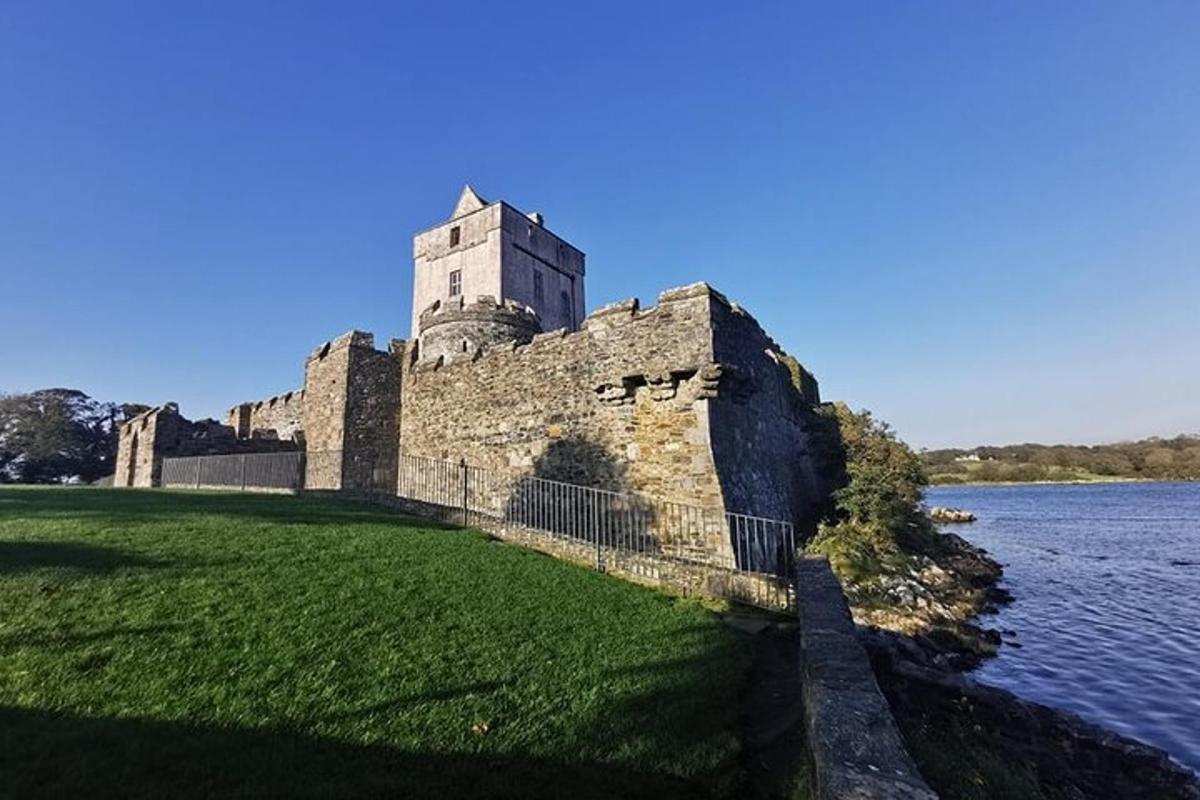 a castle on the edge of a body of water