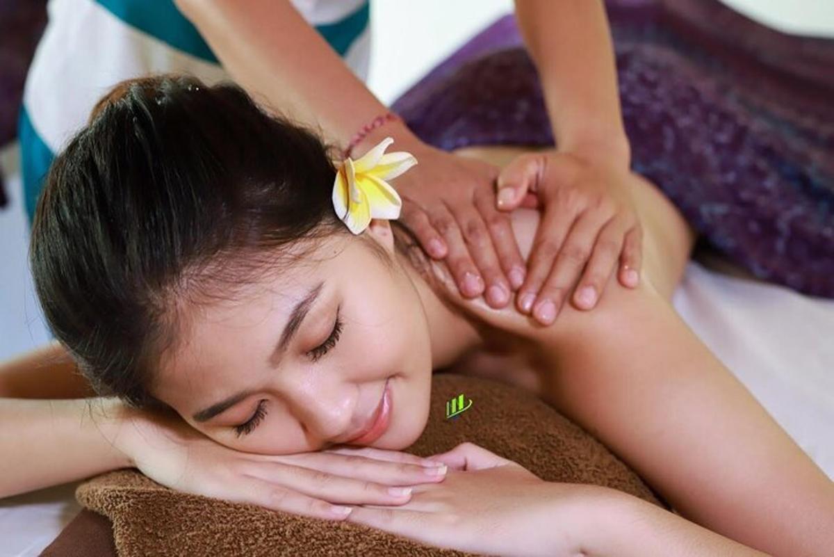 a young girl getting a massage from a therapist