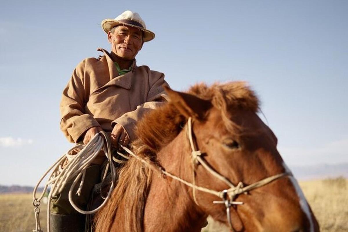 a man riding a horse in a field