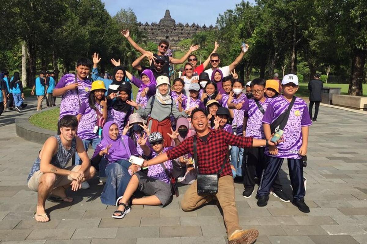 a group of people in purple shirts posing for a picture