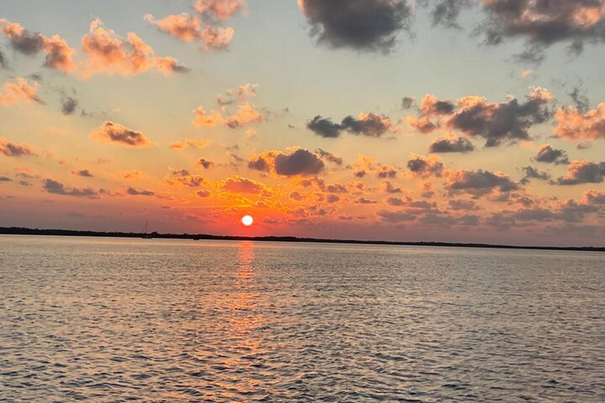 a sunset over a large body of water