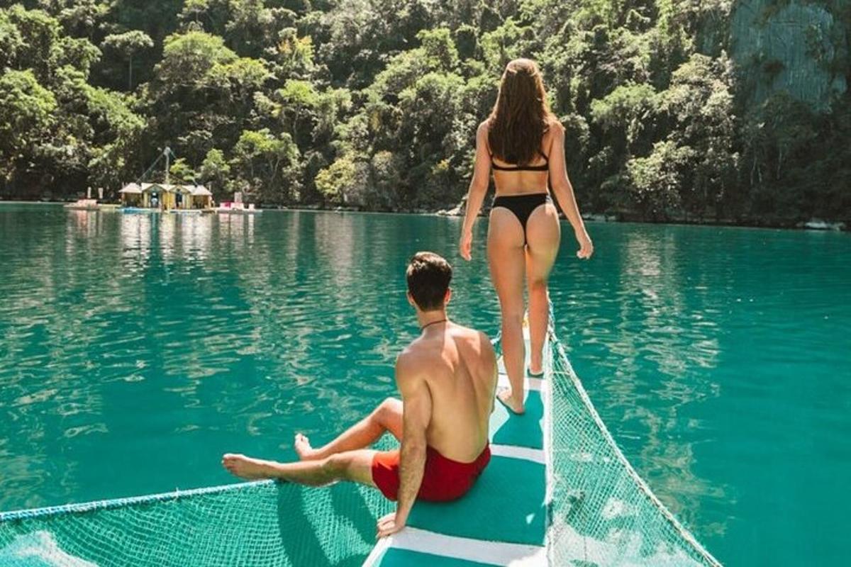 a man and a woman on a raft in the water