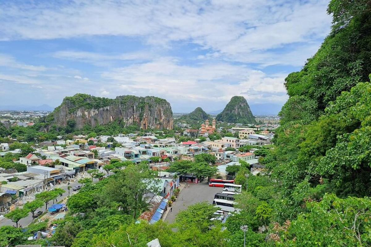 a view of a town with mountains in the background