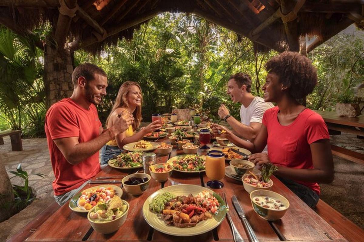a group of people sitting around a table eating food