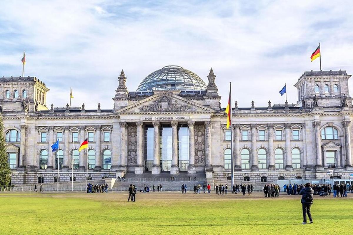 a large building with people standing in front of it