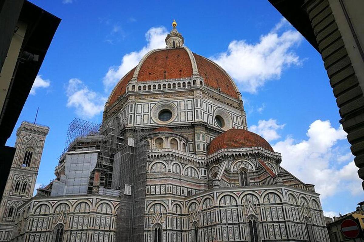 a building with a dome and a clock tower