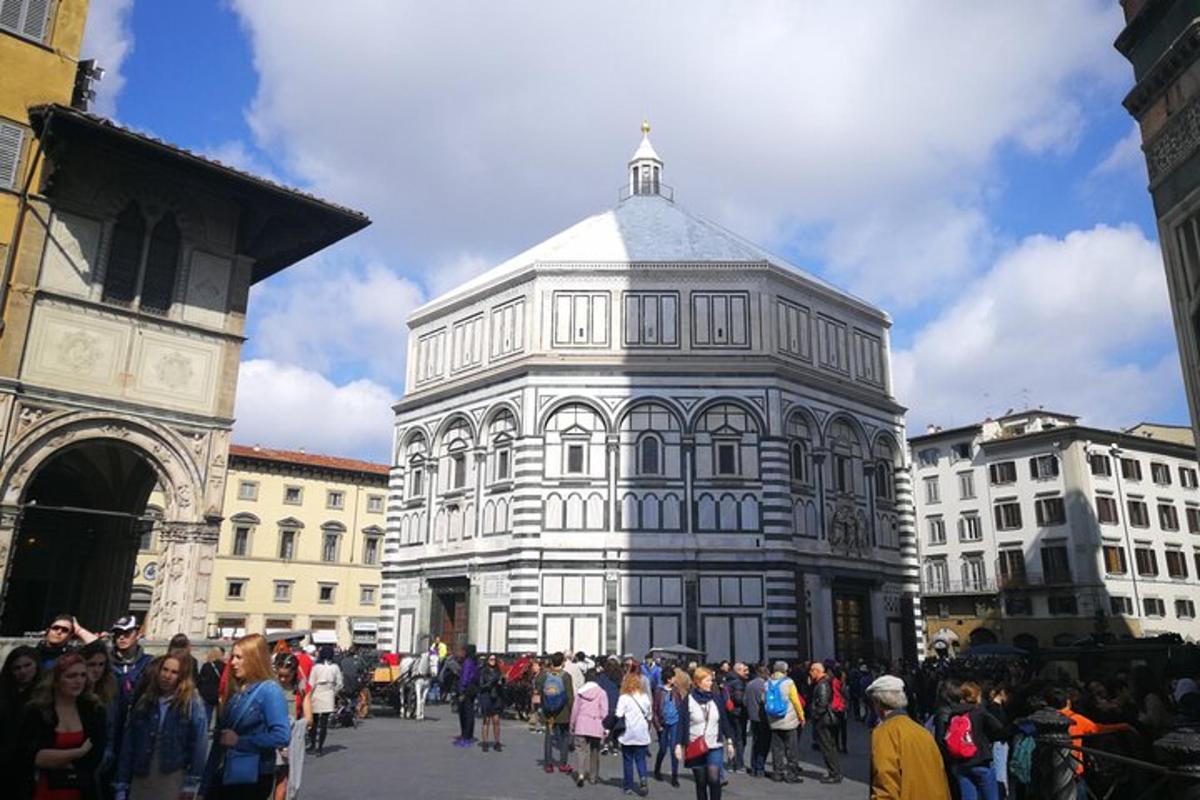 a crowd of people standing around a large building