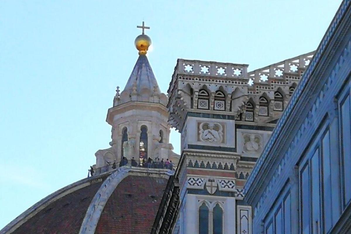 a church steeple with a cross on top of it