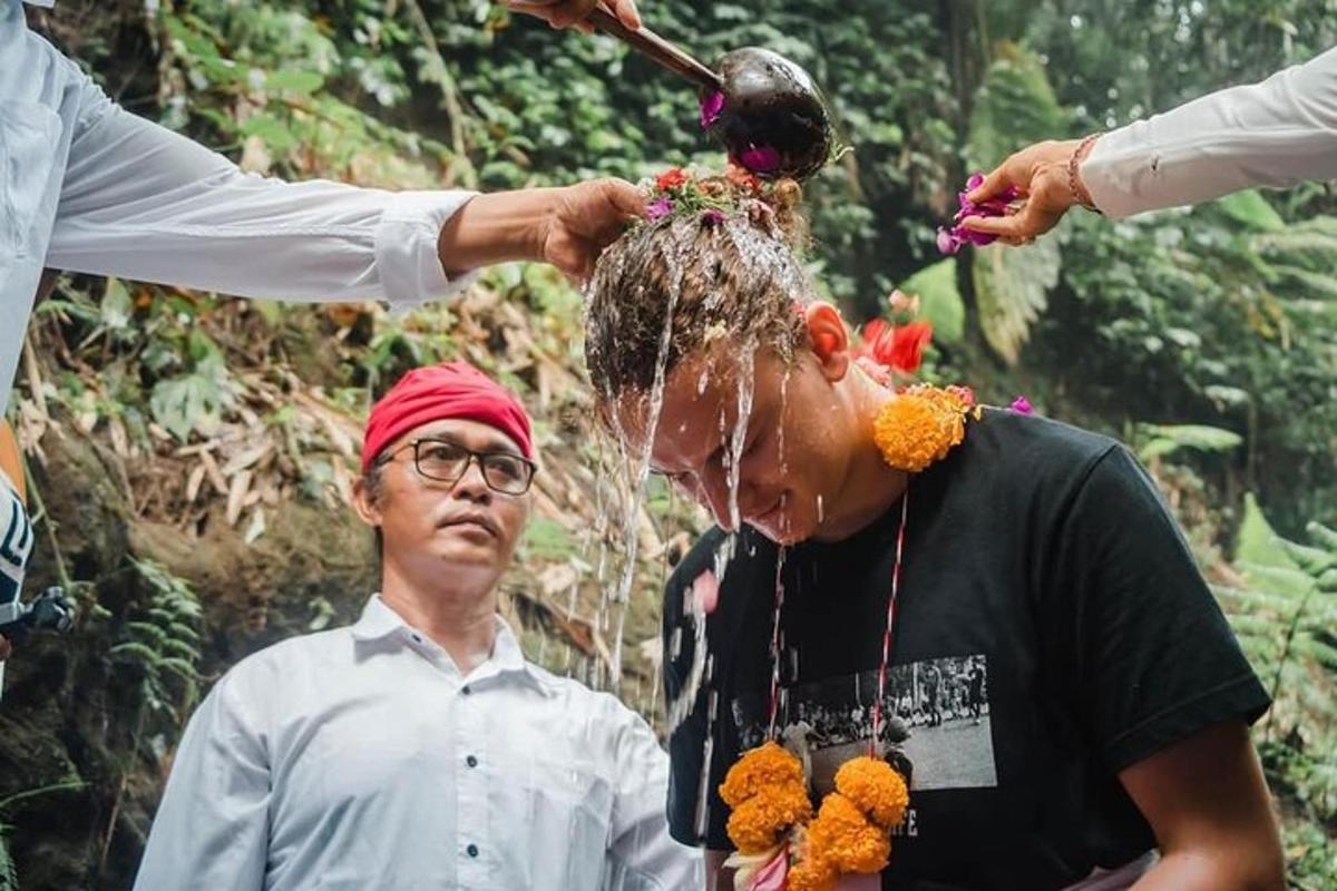 a man getting a hair cut by a person