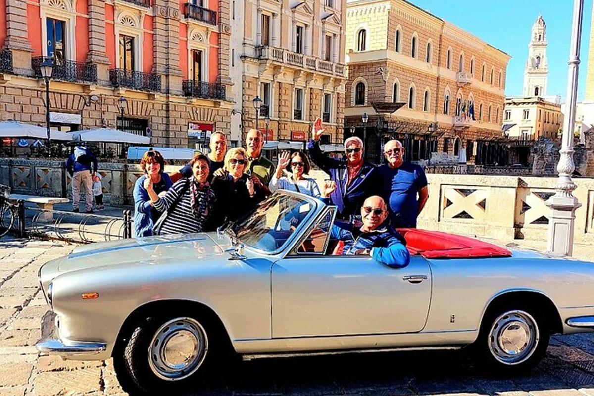 a group of people standing next to a car