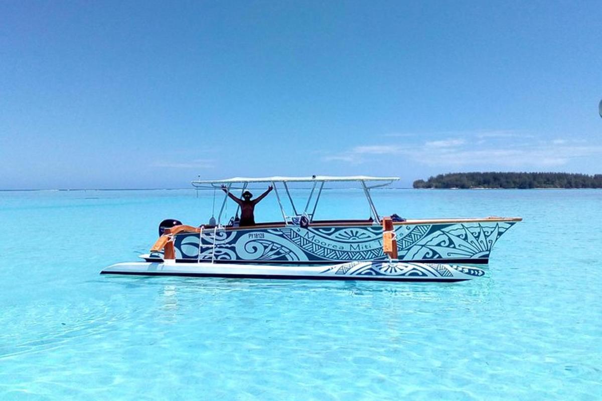 a man standing on a boat in the water