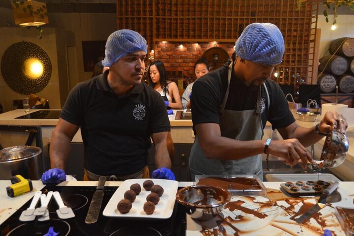 two men standing in a kitchen preparing food