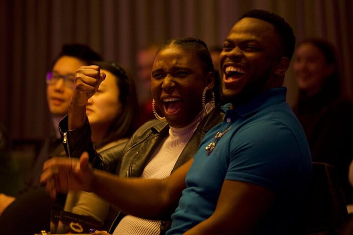 a group of people laughing in a room