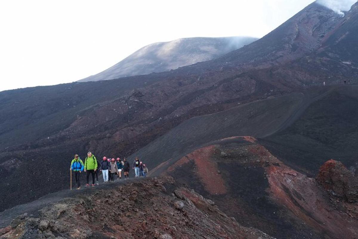 a group of people standing on top of a mountain