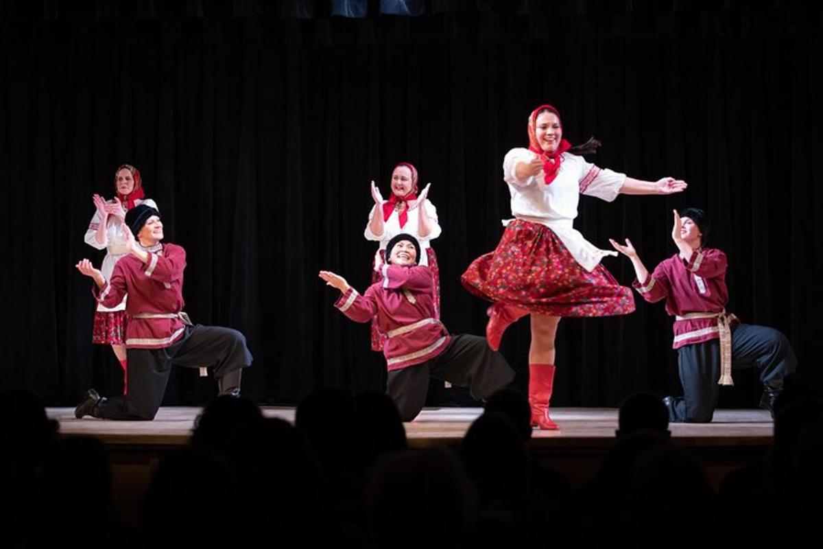 a group of people dancing on a stage