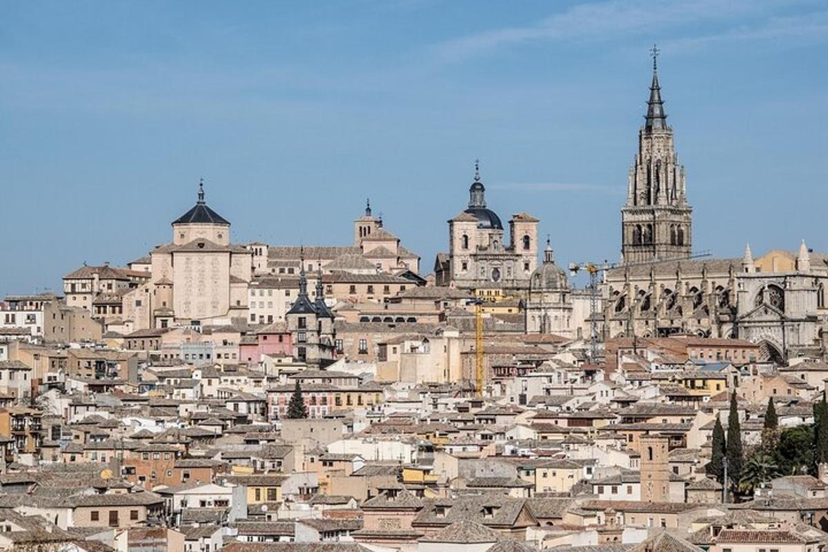 a view of a city with buildings and a cathedral