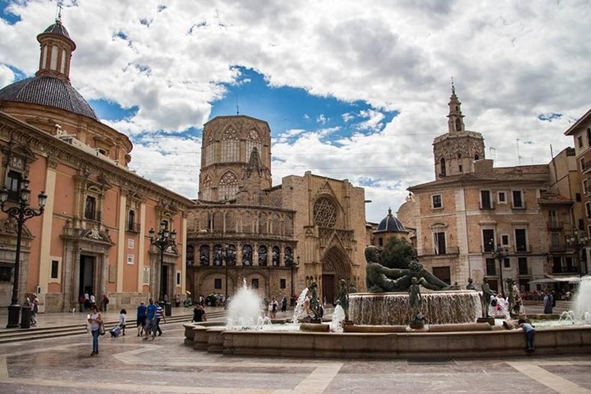 a courtyard with a fountain in front of a building